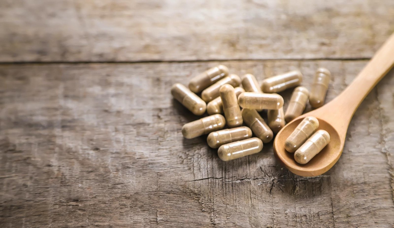 There are many herbal supplements in capsules. Selective focus.